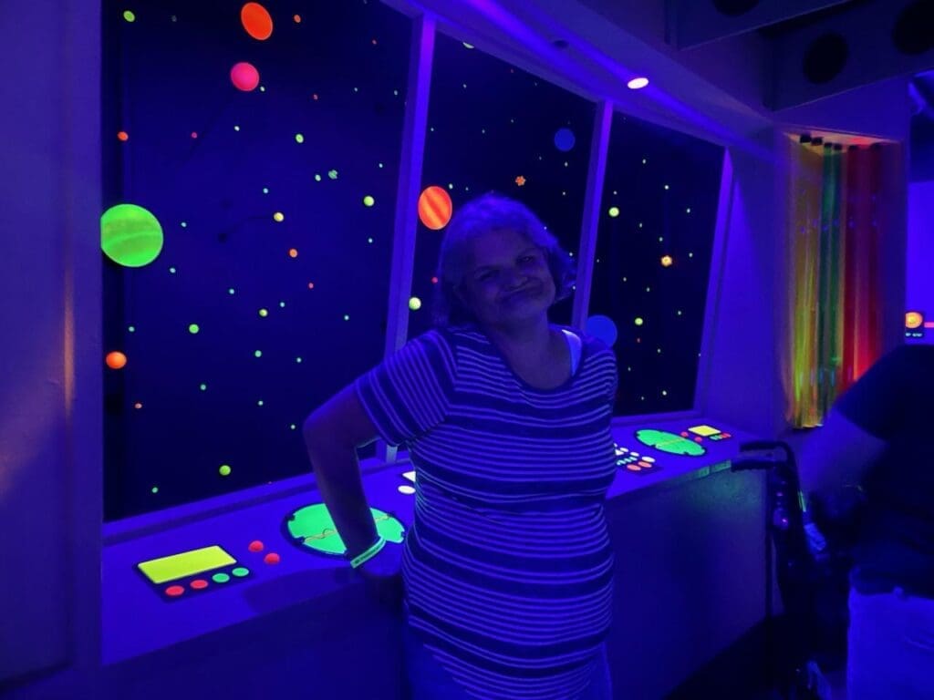 IMG_20250708_153032 A client posing in the UFO museum using day services